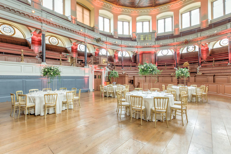 Photo of the Sheldonian Theatre with tables set up for a wedding