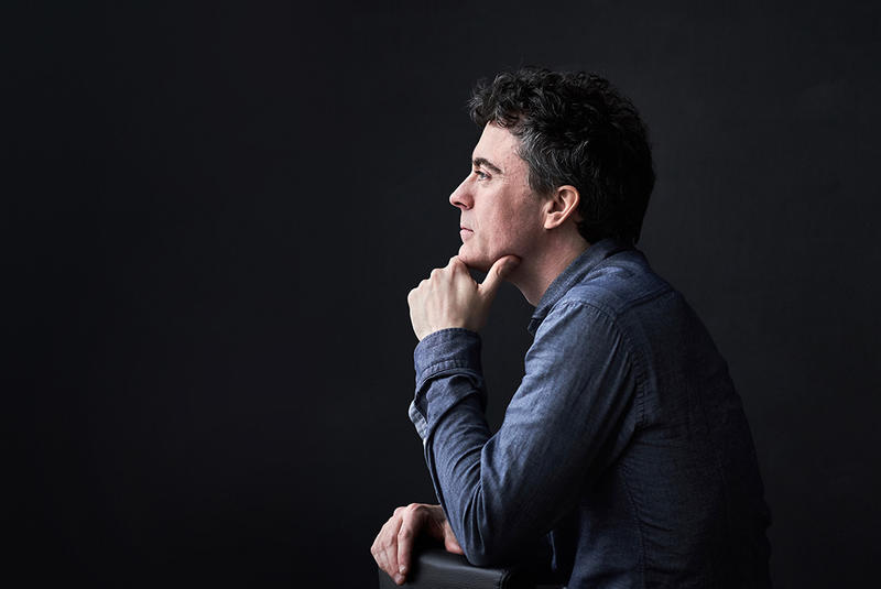 Profile photo of Paul Lewis against a black background